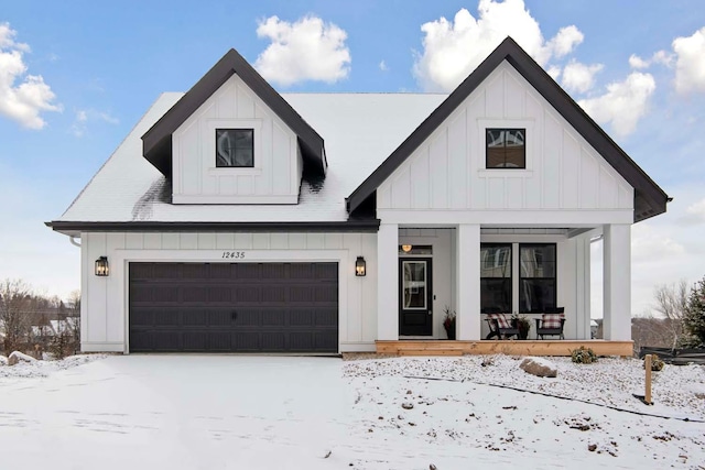 modern farmhouse style home with a porch and a garage