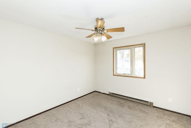 carpeted empty room featuring ceiling fan and a baseboard radiator