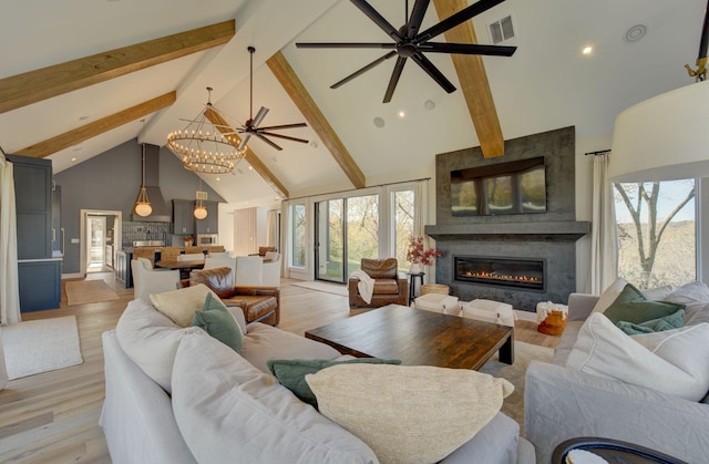 6620 Buckthorn Dr NW, Rochester, MN 55901 - living room featuring high vaulted ceiling, beamed ceiling, a ceiling fan, healthy amount of natural light, and a large fireplace