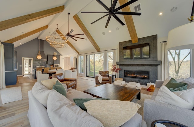 6620 Buckthorn Dr NW, Rochester, MN 55901 - living room featuring high vaulted ceiling, beam ceiling, a ceiling fan, plenty of natural light, and a large fireplace