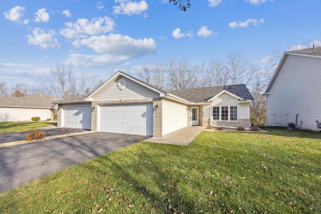 ranch-style home with a front lawn and a garage