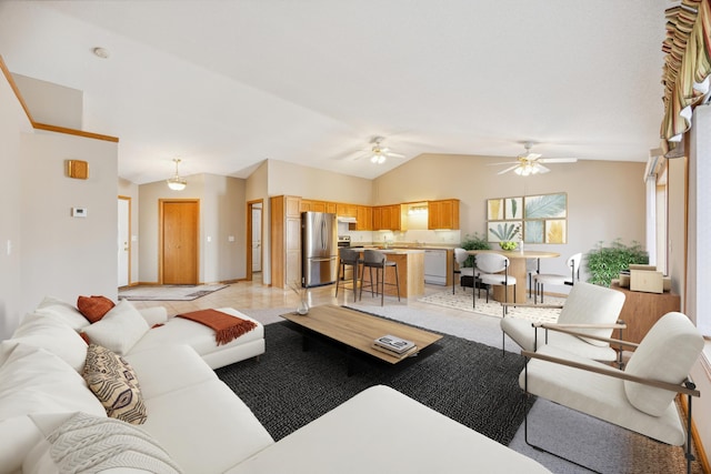 living room featuring lofted ceiling, light tile patterned floors, and ceiling fan