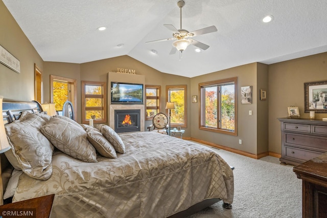 bedroom with light carpet, lofted ceiling, a textured ceiling, and ceiling fan