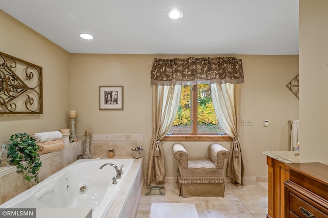 bathroom with vanity, tiled bath, and tile patterned flooring