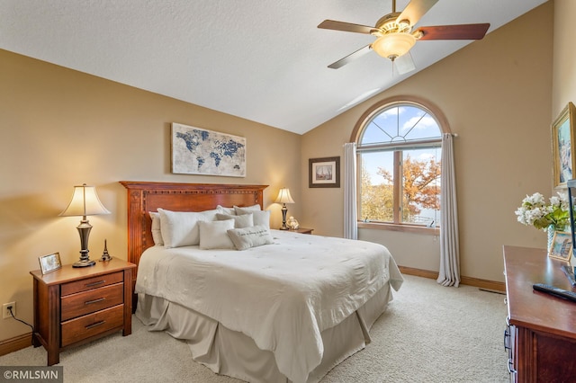 bedroom featuring light carpet, ceiling fan, and vaulted ceiling