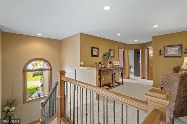 corridor with light colored carpet