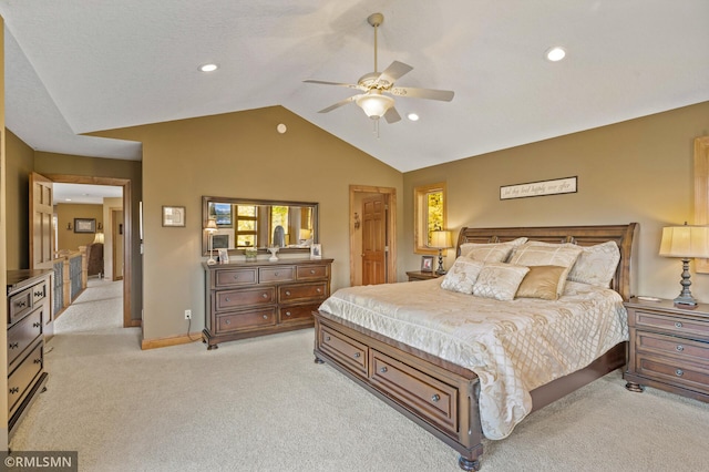 bedroom featuring light carpet, vaulted ceiling, and ceiling fan