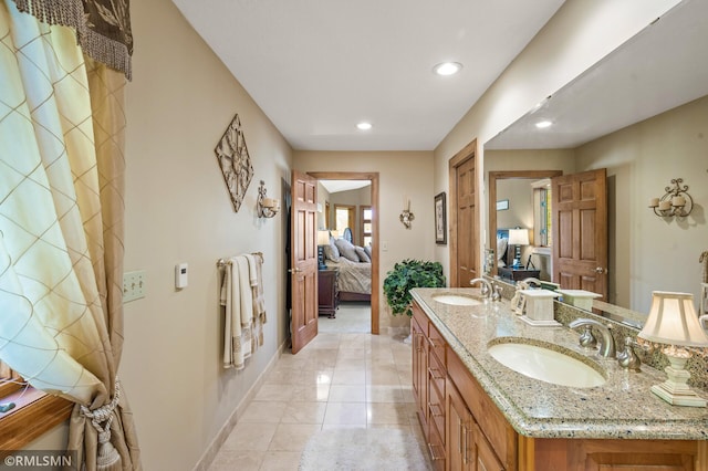 bathroom with vanity and tile patterned floors