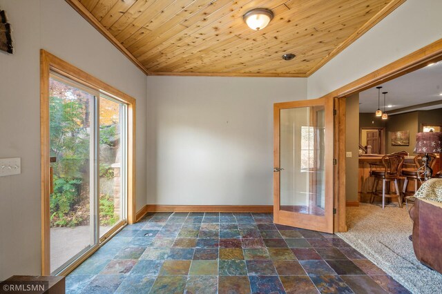 entryway featuring bar, wooden ceiling, and plenty of natural light