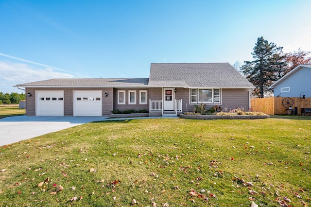 ranch-style home featuring a front yard and a garage