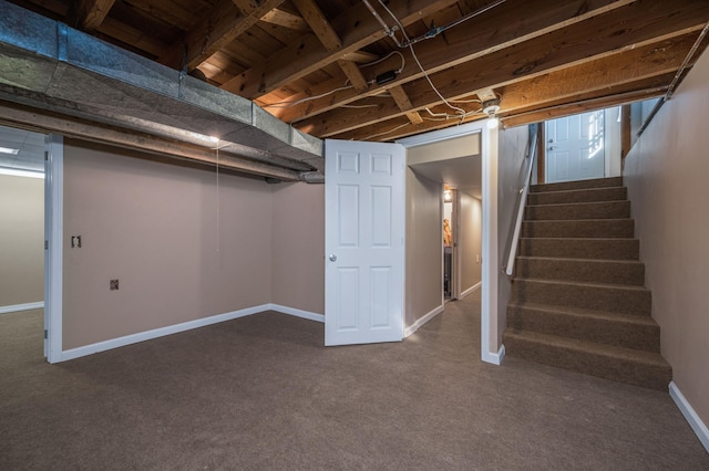 basement featuring dark colored carpet