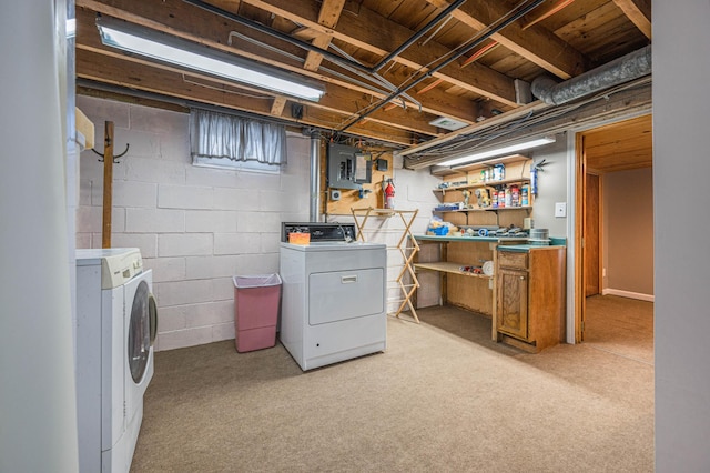 washroom with electric panel, light colored carpet, and separate washer and dryer