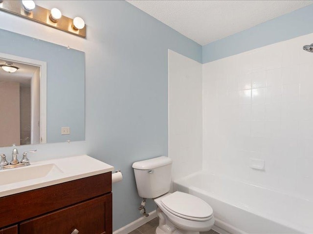 full bathroom featuring washtub / shower combination, vanity, a textured ceiling, and toilet