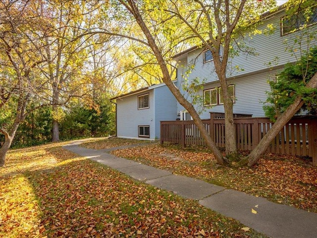 view of property exterior featuring a deck