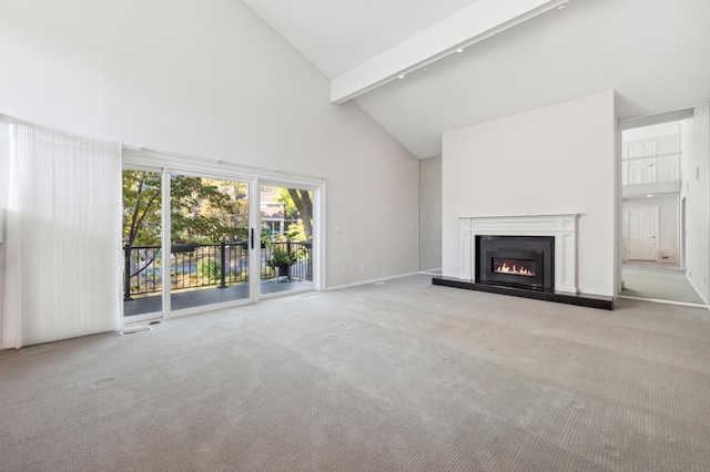 unfurnished living room with light colored carpet and high vaulted ceiling