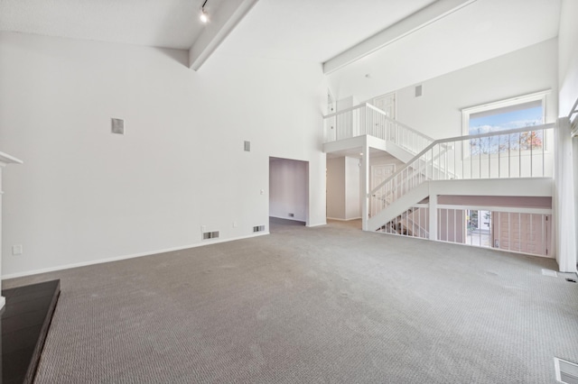 7653 Woodview Ct, Edina, MN 55439 - unfurnished living room with carpet, beam ceiling, visible vents, and high vaulted ceiling