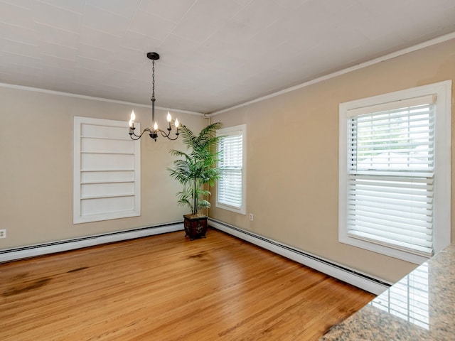 unfurnished room with a baseboard heating unit, built in features, hardwood / wood-style floors, ornamental molding, and a chandelier