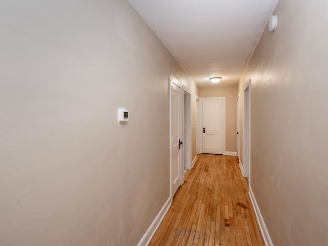 hall with light hardwood / wood-style floors