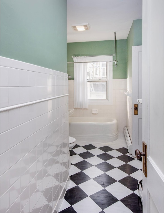 bathroom with baseboard heating, tile walls, separate shower and tub, and toilet