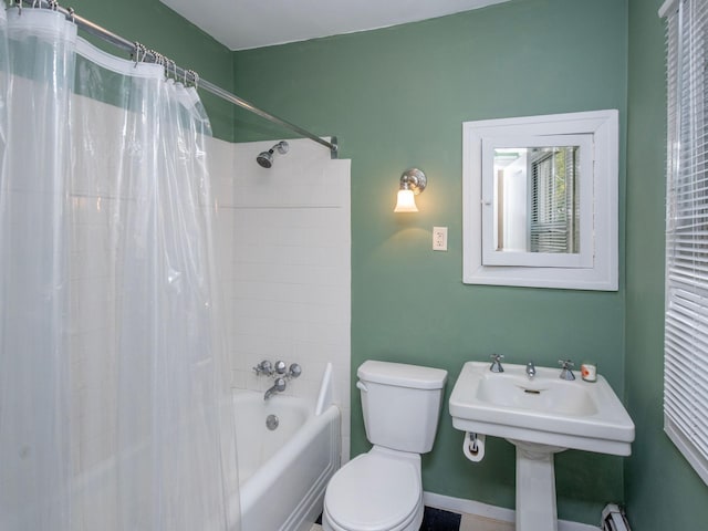 bathroom with toilet and shower / tub combo with curtain