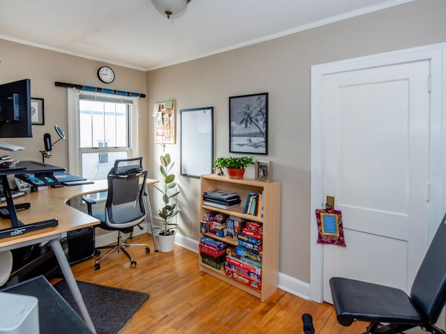 office area featuring light hardwood / wood-style floors and ornamental molding