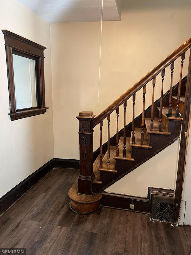 stairway featuring hardwood / wood-style floors