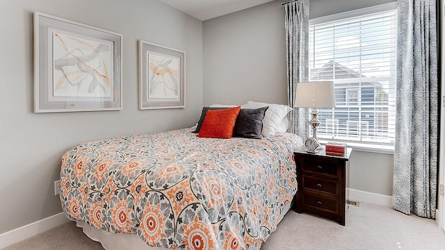 bedroom with light colored carpet