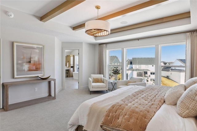 bedroom with beamed ceiling and light carpet