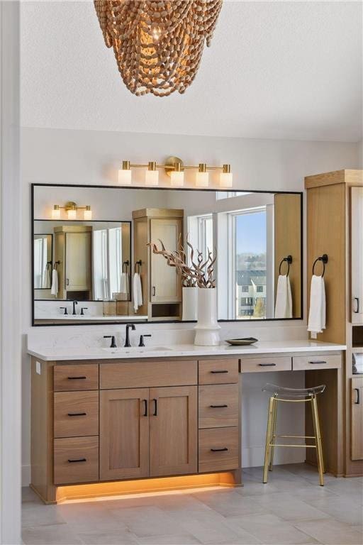 bathroom with vanity and a textured ceiling