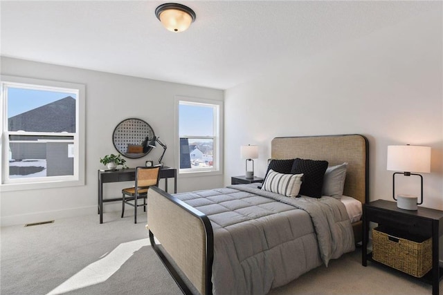 bedroom with light colored carpet