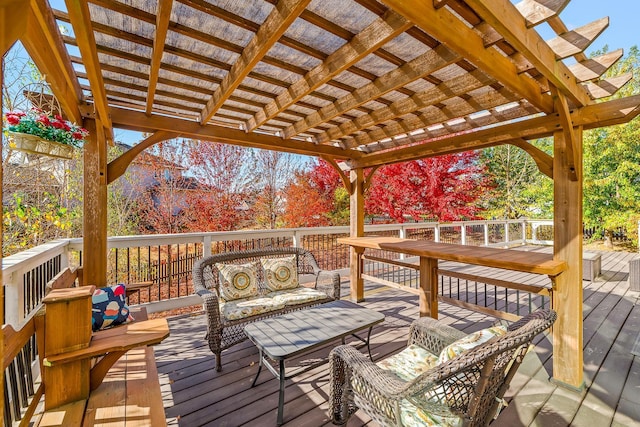 wooden terrace with a pergola and an outdoor living space