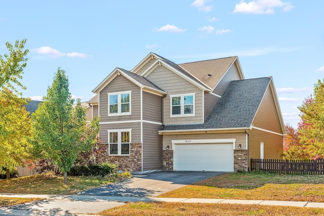 craftsman house with a garage