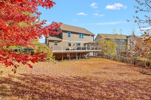 rear view of house with a wooden deck