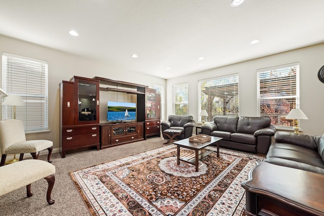 living room with light carpet and plenty of natural light