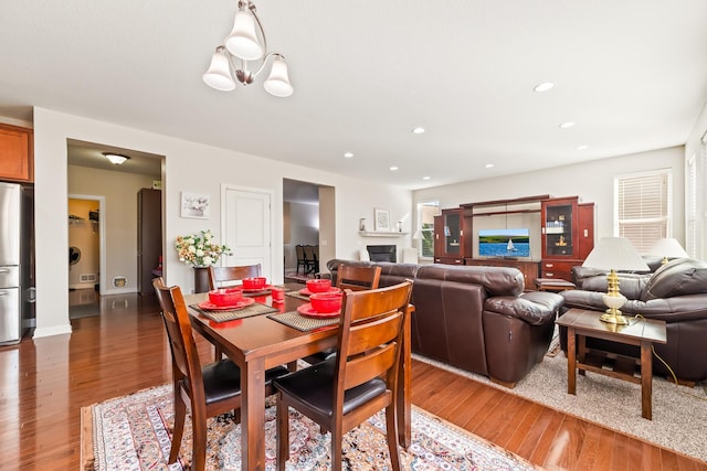 dining area featuring a chandelier and dark wood-type flooring