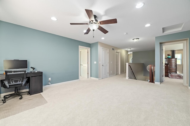 office space with light colored carpet and ceiling fan