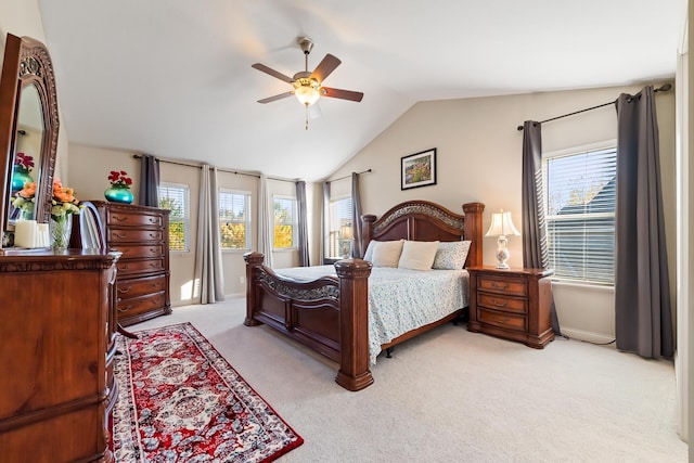 bedroom featuring ceiling fan, light colored carpet, and lofted ceiling