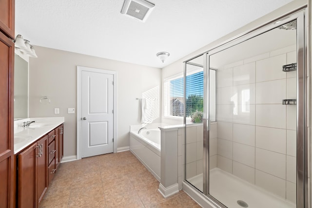 bathroom featuring tile patterned floors, vanity, and independent shower and bath