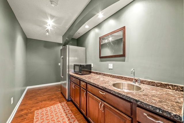 bathroom featuring vanity, a textured ceiling, and hardwood / wood-style flooring