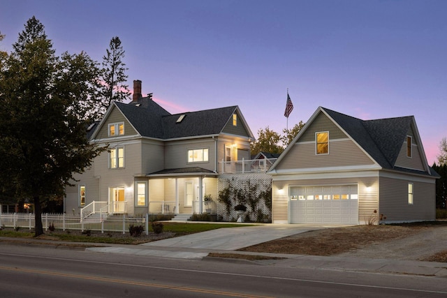 view of front of property featuring a garage and a porch