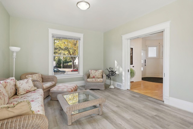 living room with light hardwood / wood-style flooring