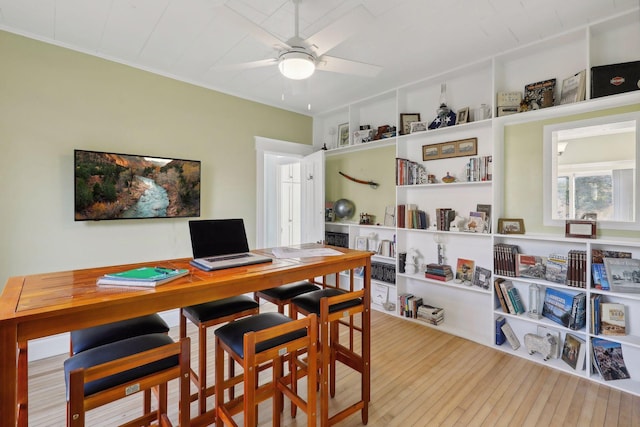 office area featuring crown molding, hardwood / wood-style flooring, and ceiling fan