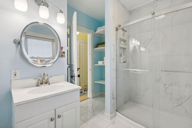 bathroom featuring vanity and an enclosed shower