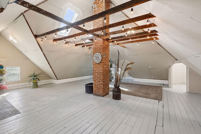 room details with wood-type flooring and a skylight