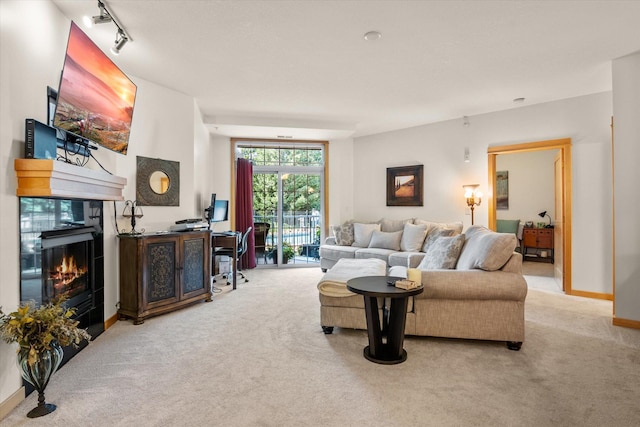 living room with light carpet and rail lighting