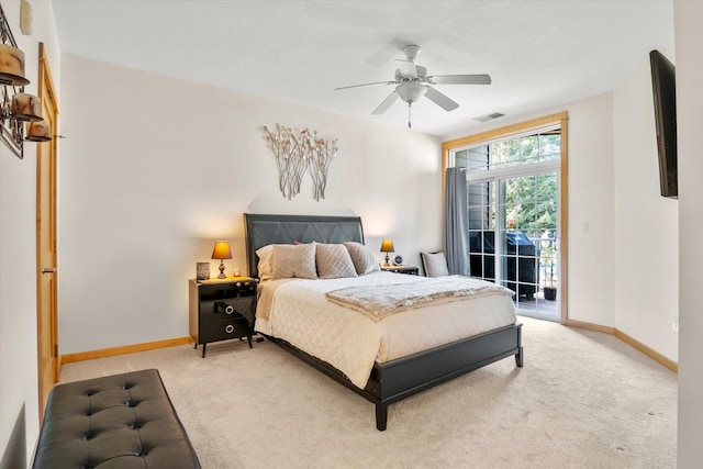 carpeted bedroom featuring access to exterior and ceiling fan