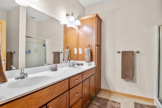 bathroom featuring vanity, tile patterned flooring, and an enclosed shower