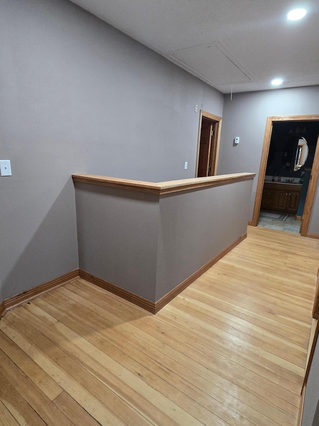 interior space featuring hardwood / wood-style flooring, baseboards, and recessed lighting