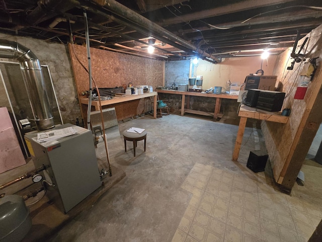 unfinished basement with a workshop area
