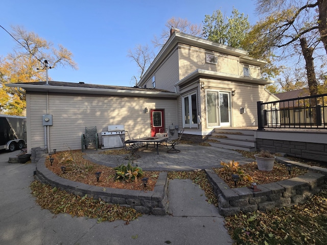 back of house with a patio area and french doors